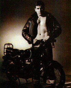 Photo by Tom Nicoll, early 1950's black leather jeans, jacket and a bike